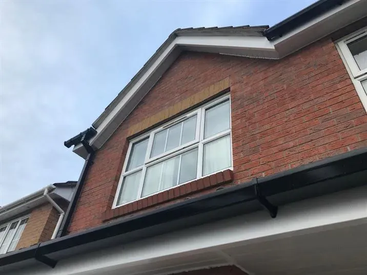 Majestic Roofing repairing a slate roof ridge in Bath, with lead flashing and ridge cap replacement in progress